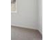 Clean carpeted room with a window at 9081 Telluride Ct, Commerce City, CO 80022