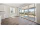 Open dining area with hardwood floors, large sliding glass doors, and plenty of natural light at 9081 Telluride Ct, Commerce City, CO 80022