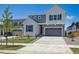 Beautiful two-story home featuring a two-car garage, modern design, and well-maintained landscaping at 9081 Telluride Ct, Commerce City, CO 80022