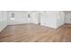 Bright living room featuring hardwood floors, multiple windows, and neutral paint at 9081 Telluride Ct, Commerce City, CO 80022