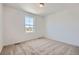 Bright bedroom features neutral carpet and a window that offers plenty of natural light at 662 N Clubview St, Watkins, CO 80137