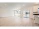 Bright open living space featuring wood-style flooring, recessed lighting, and sliding glass doors to the backyard at 662 N Clubview St, Watkins, CO 80137