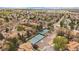 Overhead view showing tennis courts, homes, and lush landscaping, showcasing a vibrant community setting at 1571 S Trenton Ct, Denver, CO 80231