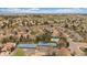 Overhead view of community featuring tennis courts, a pool, and cozy homes surrounded by mature trees at 1571 S Trenton Ct, Denver, CO 80231