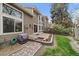 Charming backyard with patio, garden bed, and lush lawn, perfect for outdoor relaxation and entertaining at 1571 S Trenton Ct, Denver, CO 80231
