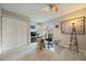 Bright bedroom with closet, a ceiling fan and large windows providing natural light at 1571 S Trenton Ct, Denver, CO 80231