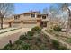 Charming two-story home with a well-maintained lawn and inviting curb appeal at 1571 S Trenton Ct, Denver, CO 80231