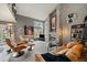 Inviting living room features a cozy fireplace, large windows, and comfortable seating area at 1571 S Trenton Ct, Denver, CO 80231