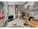 Bright living room with vaulted ceiling, fireplace, and open floor plan to upper level at 1571 S Trenton Ct, Denver, CO 80231