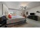 Main bedroom with a view and a TV, with carpet flooring and soft, neutral colors at 1571 S Trenton Ct, Denver, CO 80231