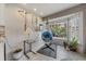 Cozy sun room with hanging chair, large window, and relaxing atmosphere at 1571 S Trenton Ct, Denver, CO 80231