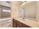 Basement bathroom with a vanity and access to the tub area at 2457 S Xenon Way, Denver, CO 80228