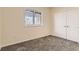 Bright basement bedroom with plush carpeting and double doors at 2457 S Xenon Way, Denver, CO 80228