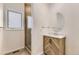 Small bathroom with shower, vanity, and single window at 2457 S Xenon Way, Denver, CO 80228