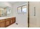 Bathroom with shower, vanity, and single window at 2457 S Xenon Way, Denver, CO 80228