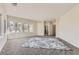 Spacious bedroom with large windows, carpet flooring, and access to bathroom at 2457 S Xenon Way, Denver, CO 80228