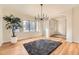 Elegant dining room with hardwood floors, large windows, and a chandelier at 2457 S Xenon Way, Denver, CO 80228