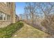 Landscaped side yard with trees and a wooden fence at 2457 S Xenon Way, Denver, CO 80228