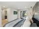 Bedroom featuring accent wall, door to outside spiral staircase, and wall-mounted TV at 2921 Newton St, Denver, CO 80211