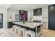 Beautiful kitchen with marble countertops, a large center island, and seating at 2921 Newton St, Denver, CO 80211