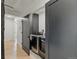 Convenient laundry room with modern washer and dryer, cabinet storage, and sleek, minimalist design at 2921 Newton St, Denver, CO 80211