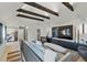Upper level living room showcasing high ceilings, exposed beams, and stylish furnishings at 2921 Newton St, Denver, CO 80211