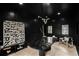 Stylish office with black walls, a marble table, and art creates a modern and sophisticated workspace at 2921 Newton St, Denver, CO 80211