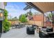 Charming patio with comfortable seating, outdoor dining area, and beautiful landscaping, perfect for relaxation and entertaining at 2921 Newton St, Denver, CO 80211