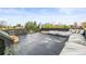 A rooftop deck is equipped with outdoor furniture and a protective railing at 2921 Newton St, Denver, CO 80211