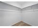Walk-in closet with wire rack shelving and neutral carpeting creating ample storage space at 17123 W 91St Ln, Arvada, CO 80007