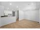 Open-concept living room with hardwood floors offering seamless transitions to the kitchen at 17123 W 91St Ln, Arvada, CO 80007