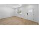 Bright living room featuring hardwood floors, ample natural light, and fresh white paint at 17123 W 91St Ln, Arvada, CO 80007
