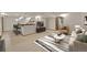 Basement living area with a comfortable sofa, modern rug, and open layout at 5722 W Chestnut Ave, Littleton, CO 80128