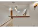 Basement bar with granite counter offers storage and pendant lighting near the stairs and a small window at 5722 W Chestnut Ave, Littleton, CO 80128