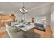 Dining area with a large table, kitchen view, and a comfortable living room setup at 5722 W Chestnut Ave, Littleton, CO 80128