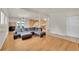 Open floor plan with kitchen, living, and dining room is great for entertaining and features hardwood floors at 5722 W Chestnut Ave, Littleton, CO 80128