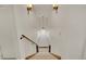 Carpeted stairway with wood banister and decorative lighting, and high ceiling at 5722 W Chestnut Ave, Littleton, CO 80128