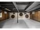 Unfinished basement featuring exposed ceiling and cement flooring at 7234 S Kendall Ct, Littleton, CO 80128