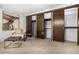 Spacious bedroom boasts a seating area and a closet with sliding doors at 7234 S Kendall Ct, Littleton, CO 80128