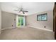 Spacious bedroom features balcony access with natural light at 7234 S Kendall Ct, Littleton, CO 80128