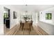 Elegant dining room with modern lighting, stylish decor, and a spacious layout at 7234 S Kendall Ct, Littleton, CO 80128