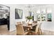 Elegant dining room featuring modern decor, a stylish light fixture, and a spacious layout at 7234 S Kendall Ct, Littleton, CO 80128
