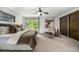 Bright main bedroom with balcony access, walk in closet and stylish furnishings at 7234 S Kendall Ct, Littleton, CO 80128
