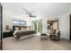 Serene main bedroom with a seating area and access to a private balcony at 7234 S Kendall Ct, Littleton, CO 80128
