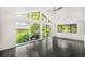 Bright sunroom with black tiled floor and expansive windows providing ample natural light at 7234 S Kendall Ct, Littleton, CO 80128