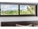 A view of mountains is seen through a bedroom window at 7234 S Kendall Ct, Littleton, CO 80128
