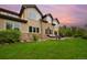 Expansive backyard with manicured lawn, stone accents and a large patio at 14370 Osage St, Westminster, CO 80023