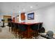 Basement wet bar with seating and mountain view art at 14370 Osage St, Westminster, CO 80023