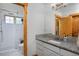 Updated bathroom with granite countertop, white subway tile and walk-in shower at 14370 Osage St, Westminster, CO 80023