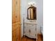 Charming bathroom with a vanity, marble countertop, and decorative mirror at 14370 Osage St, Westminster, CO 80023